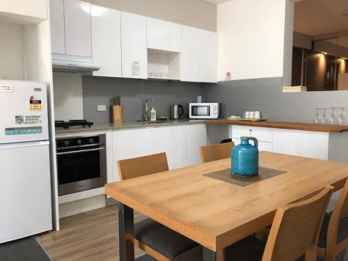 Η κουζίνα ή μικρή κουζίνα στο Morisset Serviced Apartments