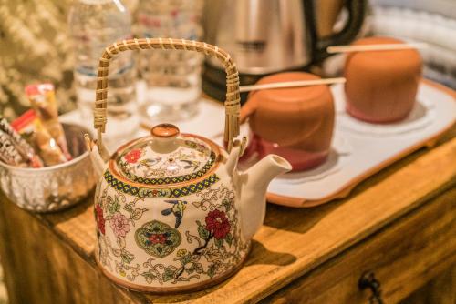 a tea kettle sitting on a wooden counter top at Atilla's Cave Hotel in Nevsehir