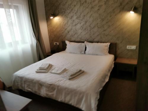 Postel nebo postele na pokoji v ubytování DNT HOUSE &spa