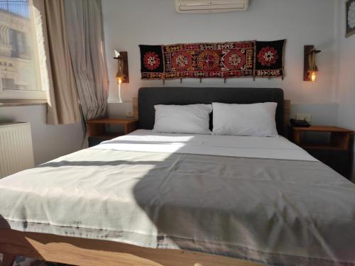 Ένα ή περισσότερα κρεβάτια σε δωμάτιο στο Marmara Guesthouse