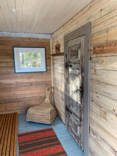 an empty room with an open door and a window at Wilderness and Calmness in Lapland in Nattavaara