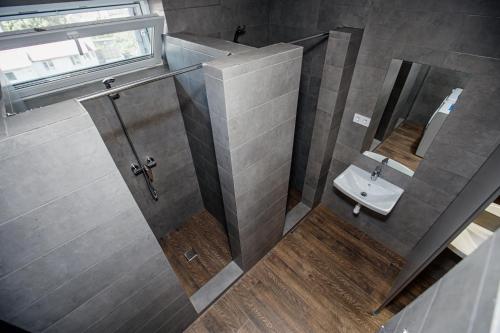 a bathroom with a sink and a mirror at Новый хостел Nesvit Киев Академгородок in Kyiv