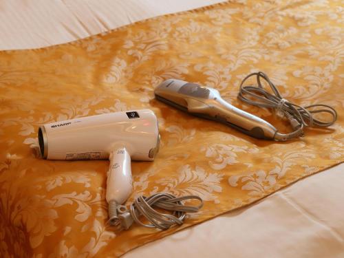 a hair dryer sitting on top of a table at Hotel Grand Fine Kyoto Minami in Kyoto