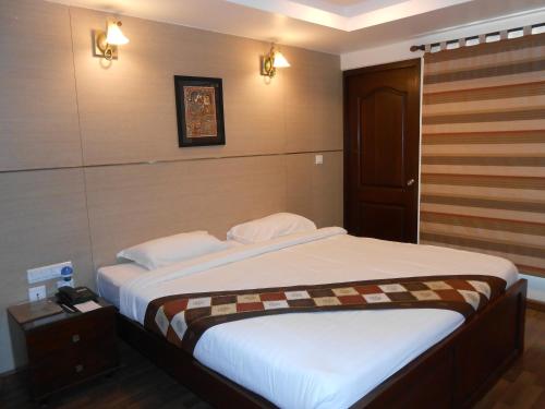 A bed or beds in a room at Brunton Heights Executive Suites