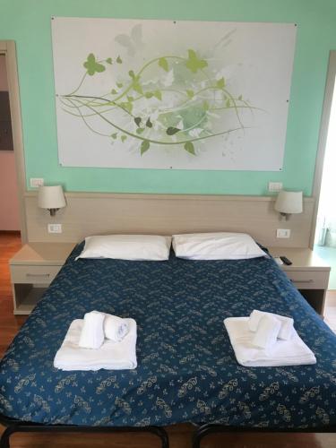 Posteľ alebo postele v izbe v ubytovaní 21 Aprile Accommodation