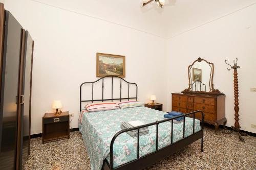 A bed or beds in a room at La Perpetua