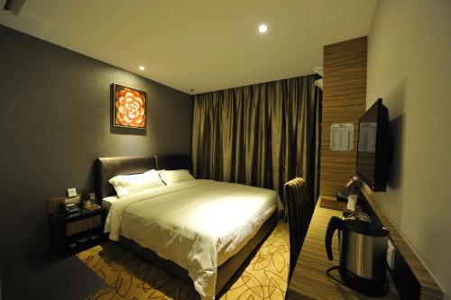 Postel nebo postele na pokoji v ubytování Milano Hotel