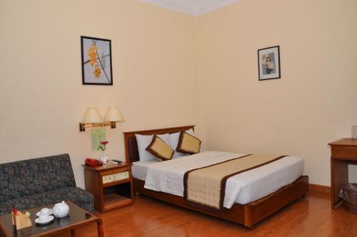 Ένα ή περισσότερα κρεβάτια σε δωμάτιο στο Saigon Can Tho Hotel