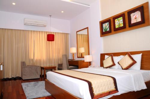 Posteľ alebo postele v izbe v ubytovaní Saigon Can Tho Hotel
