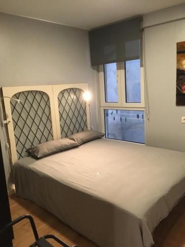 A bed or beds in a room at Studio 7calles, Casco Viejo. Bio