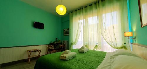 Postel nebo postele na pokoji v ubytování Il Giglio Guest House