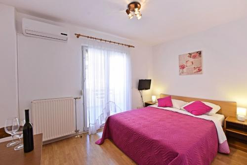 Posteľ alebo postele v izbe v ubytovaní Apartments Vila Marinela