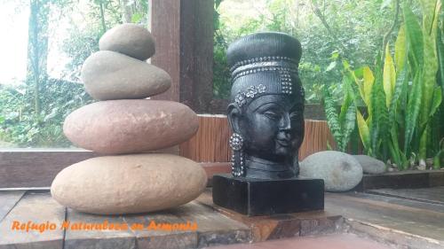 a statue of a head with a stack of rocks at Naturaleza en armonia in San Francisco