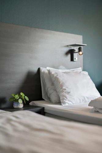 Ένα ή περισσότερα κρεβάτια σε δωμάτιο στο Easy Stay Haugesund
