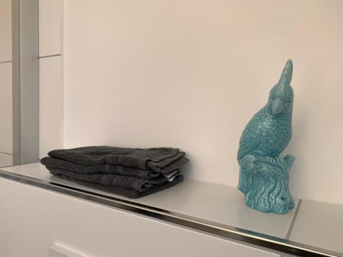 a shelf with a towel and a vase on it at Apartment Brander Blick in Aachen