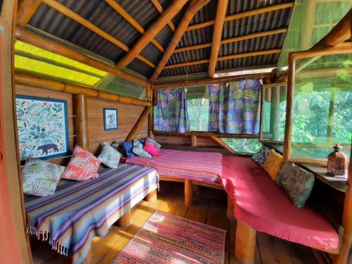 Ένα ή περισσότερα κρεβάτια σε δωμάτιο στο Mariri Jungle Lodge