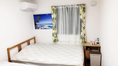 Кровать или кровати в номере 竹内公寓