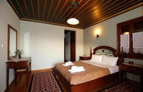 Papigiotis Hotelにあるベッド