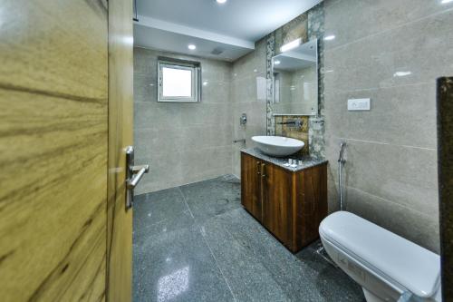a bathroom with a sink and a mirror at Hotel The Montreal in Srinagar