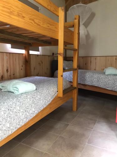 a bunk bed room with two bunk beds in it at Casa o Futuro in Alcobaça