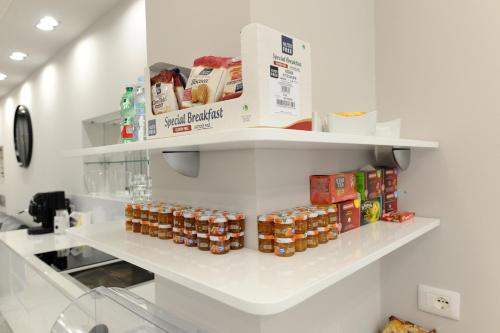 a store aisle with shelves with food items at B&B La Dolce Vita in Fondi