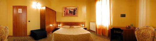 a bedroom with a bed in a room with a window at La Luna Guest House in Florence