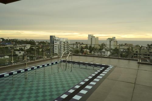 a swimming pool on the roof of a building at SkyCasa Holiday Apartments in Mount Lavinia