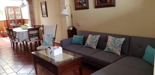 a living room with a couch and a table at Ramón y Cajal in Estepona