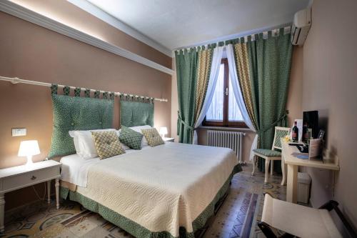 Un pat sau paturi într-o cameră la La Dimora Delle Terme