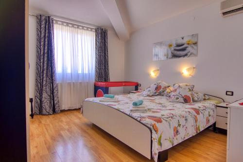 Postel nebo postele na pokoji v ubytování Apartment Nela