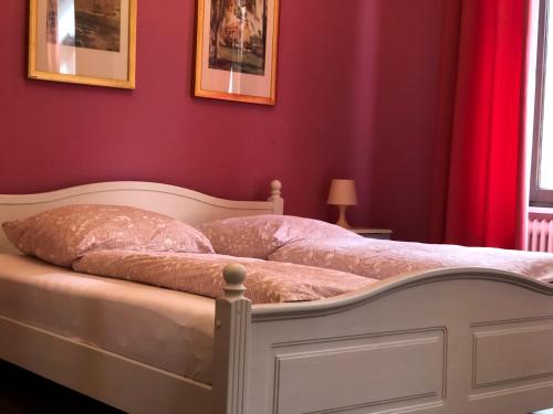 Łóżko lub łóżka w pokoju w obiekcie Pension Stadtmitte Garni