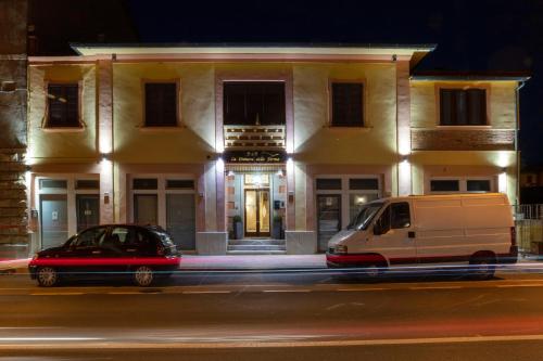 a van parked in front of a building at night at La Dimora Delle Terme in Rapolano Terme