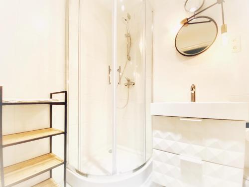 a bathroom with a shower and a sink at Faust Apartments in the Heart of Kazimierz in Krakow