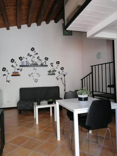 a living room with a table and a couch at Borgo i Stritti in Petralia Soprana