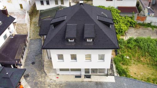 an overhead view of a house with a black roof at Apartman “Centar Jajce “ in Jajce