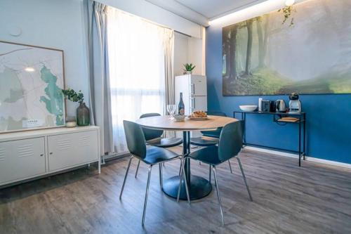 a dining room with a table and two chairs at City Apartment 302 in Loviisa