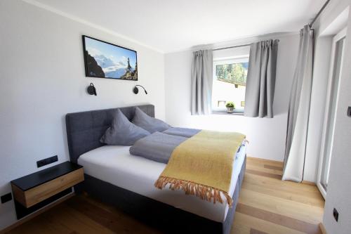 Postel nebo postele na pokoji v ubytování Chalet Maria