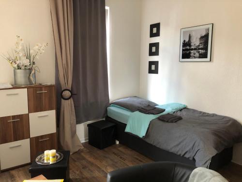 Ένα ή περισσότερα κρεβάτια σε δωμάτιο στο Appartements Nordhausen