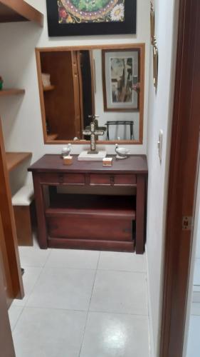 a bathroom with a sink and a mirror at El Jardín del Edén B&B Boutique in Cuernavaca