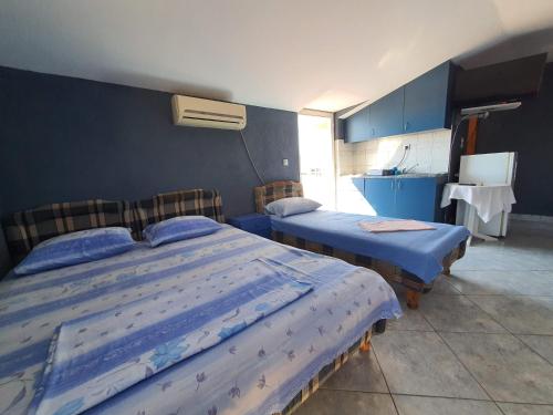 Ein Bett oder Betten in einem Zimmer der Unterkunft Apartments Milka