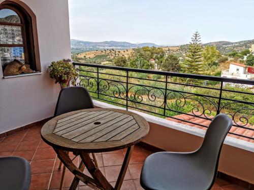 a table and chairs on a balcony with a view at Villa Filiza in Sívas