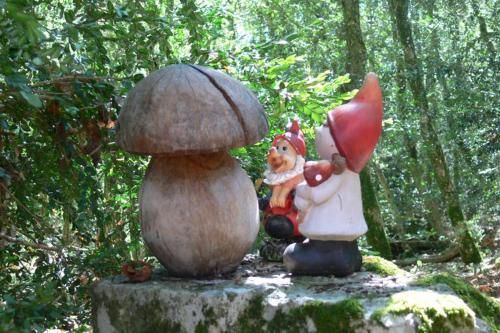 a statue of a squirrel and a mushroom at l'Empereur - La Maïsou in Sérignac