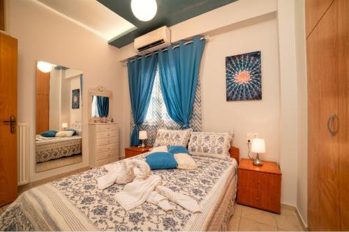 a child laying on a bed in a bedroom at Blue Boutique Apts in Amoudara Herakliou