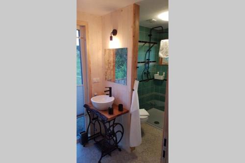 a bathroom with a sink and a shower at E Berry Farm - Slow life home in Olszyna