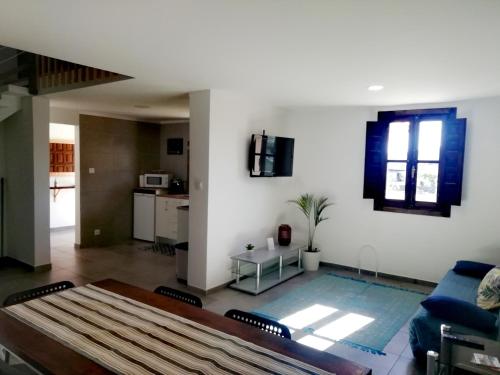 a living room with a couch and a table at The Best House in Bragança