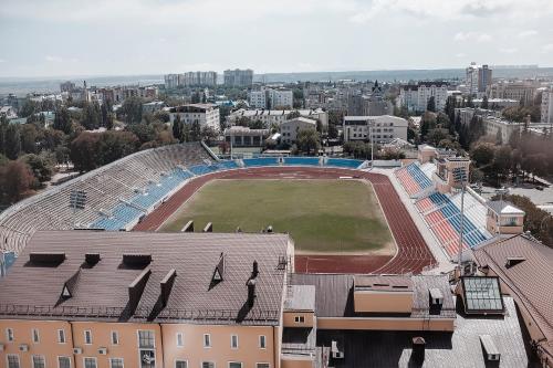 an aerial view of a soccer field in a city at Continent Hotel in Stavropol