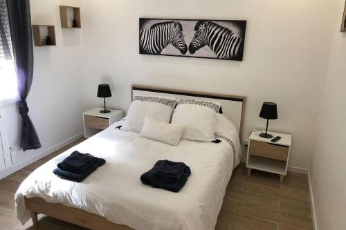 Llit o llits en una habitació de Agréable Maison entre Bordeaux et le Bassin