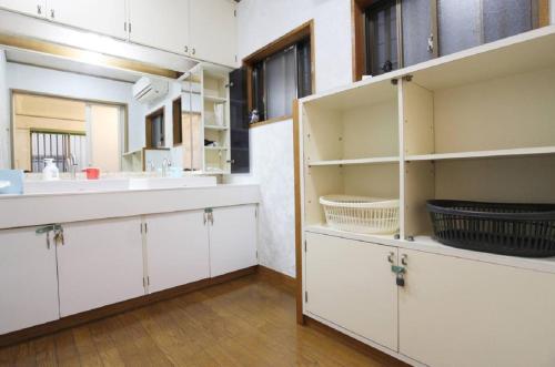 A kitchen or kitchenette at Yadokari Osaka