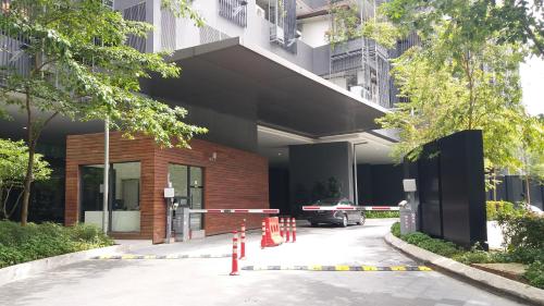 a building with orange cones in front of it at M City Jalan Ampang KL in Kuala Lumpur