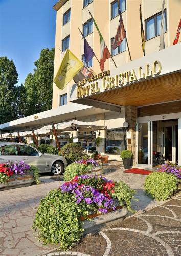 a hotel with flowers in front of a building at Best Western Hotel Cristallo in Rovigo
